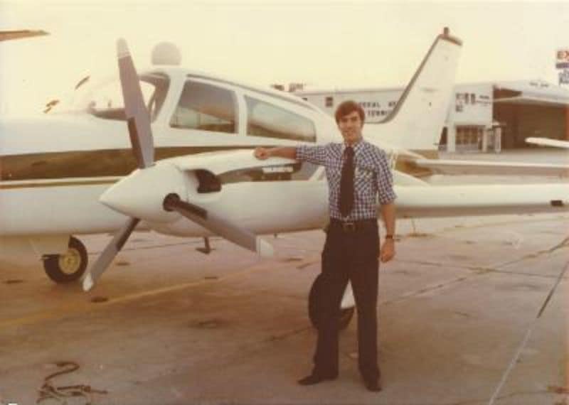 Ralph Alcock alongside an Embry-Riddle aircraft at the Daytona Beach Campus in 1978. (Photo: Ralph Alcock)