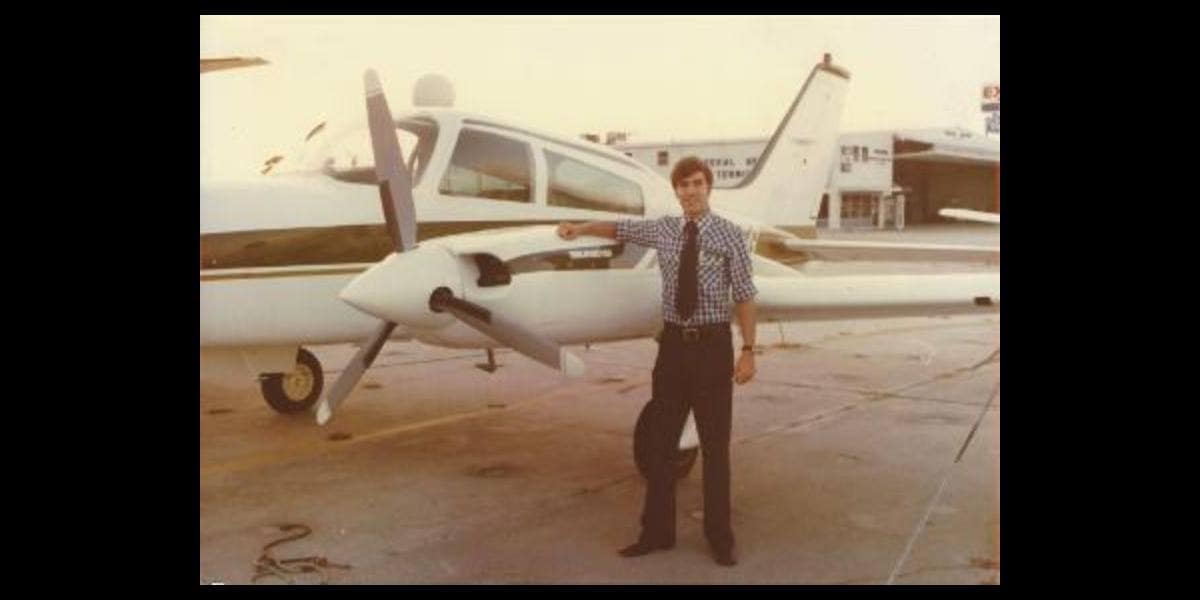 Ralph Alcock alongside an Embry-Riddle aircraft at the Daytona Beach Campus in 1978. (Photo: Ralph Alcock)