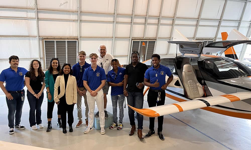 Arthur Clarke (’24) and members of the ASAC standing in front of a Velocity Aircraft after a facility tour. (Photo: Arthur Clarke)