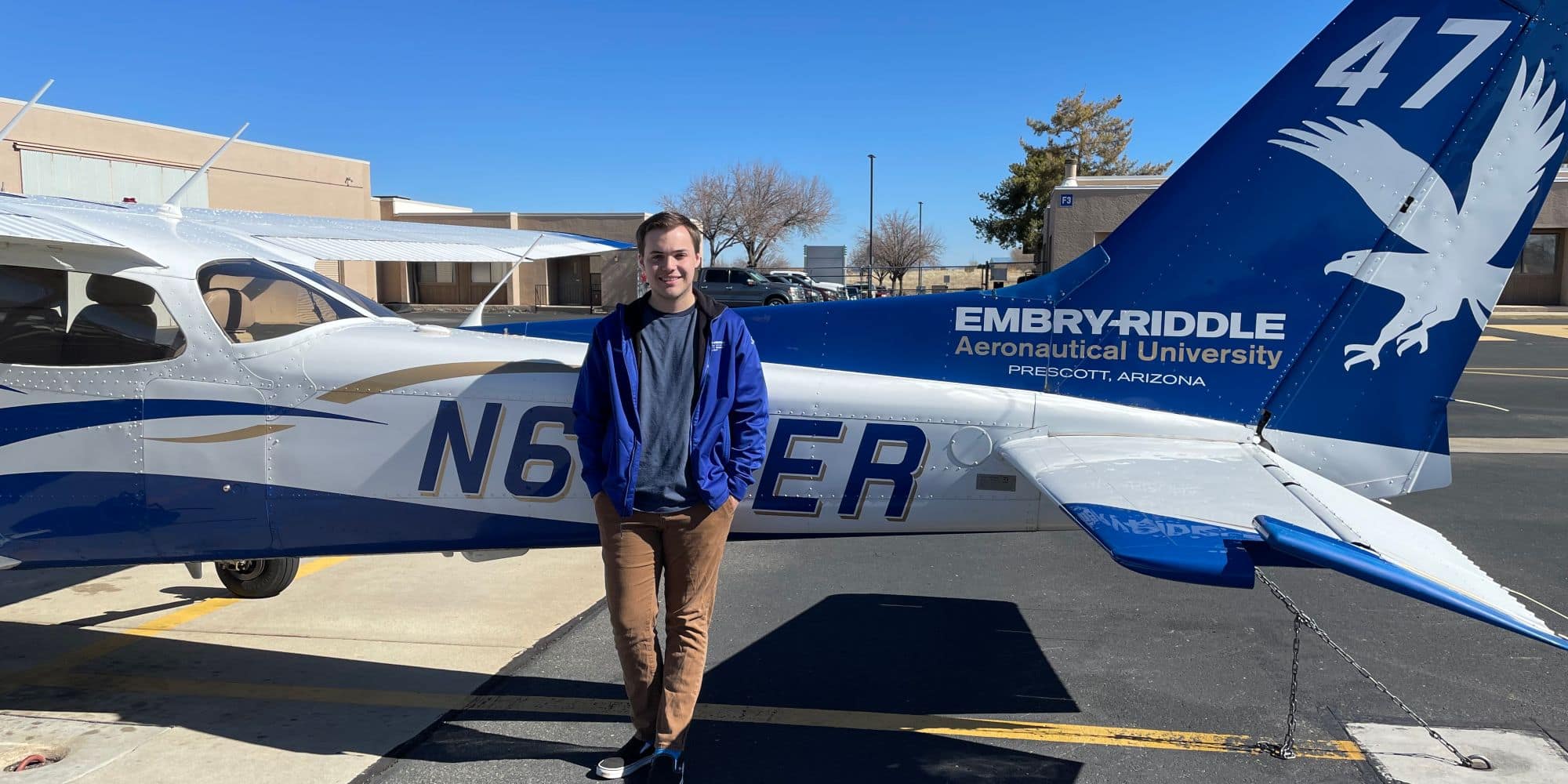Aeronautical Science major Michael Bouchard ('22) stands beside a plane on the Embry-Riddle Flight Line. (Photo: Michael Bouchard / Embry-Riddle)