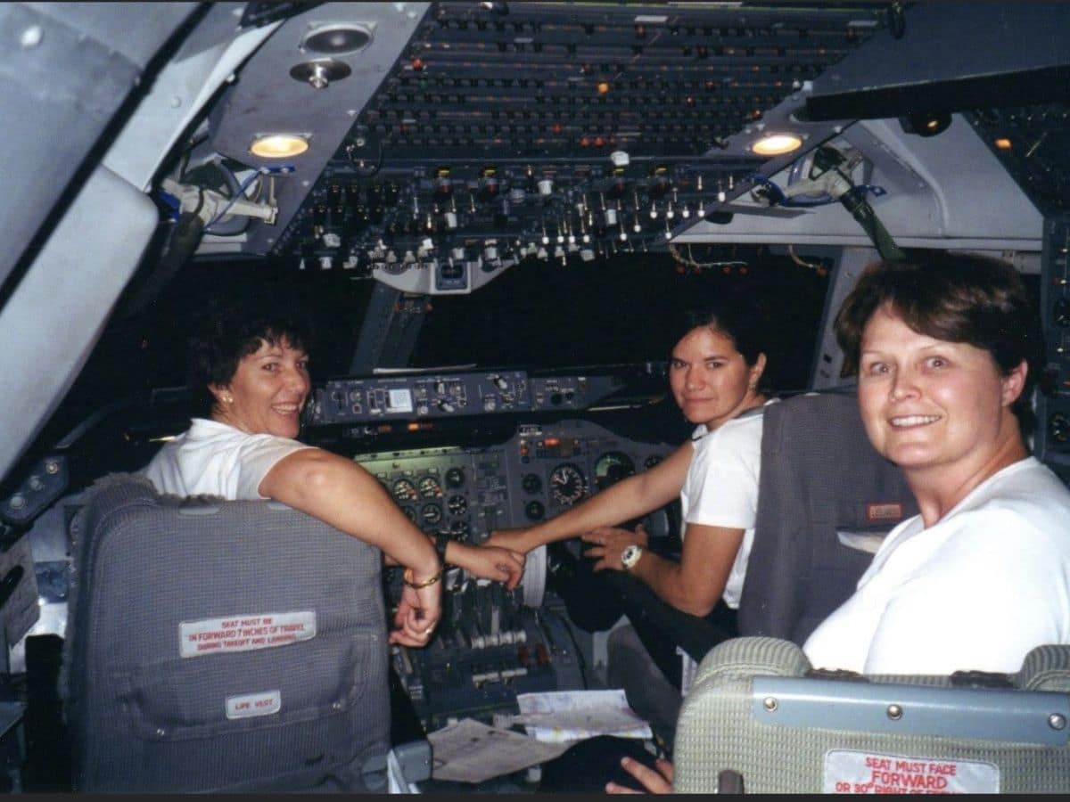 Gina Buhl ('89) in the flick deck's pilot's seat with her female co-pilots. (Photo: Gina Buhl)