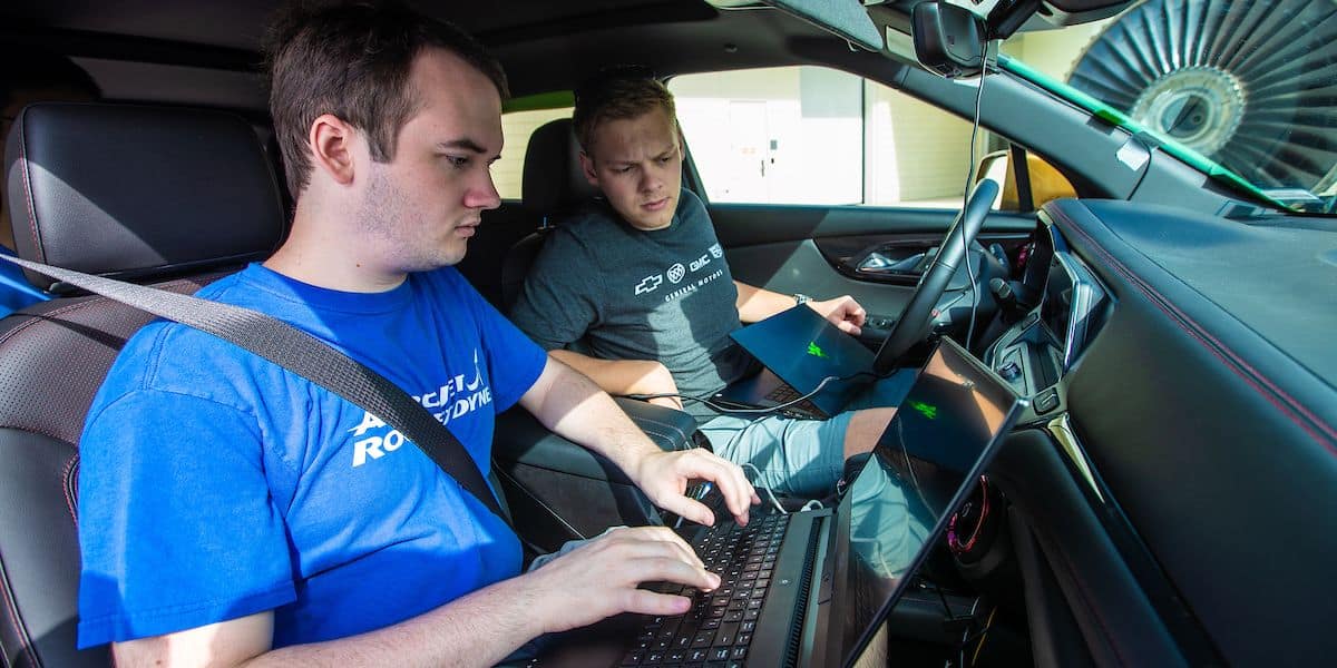 Alex Basset, right, and Alex Shiffer run some diagnostic tests before taking the EcoCar 4 out for some initial road testing. (Embry-Riddle/David Massey)