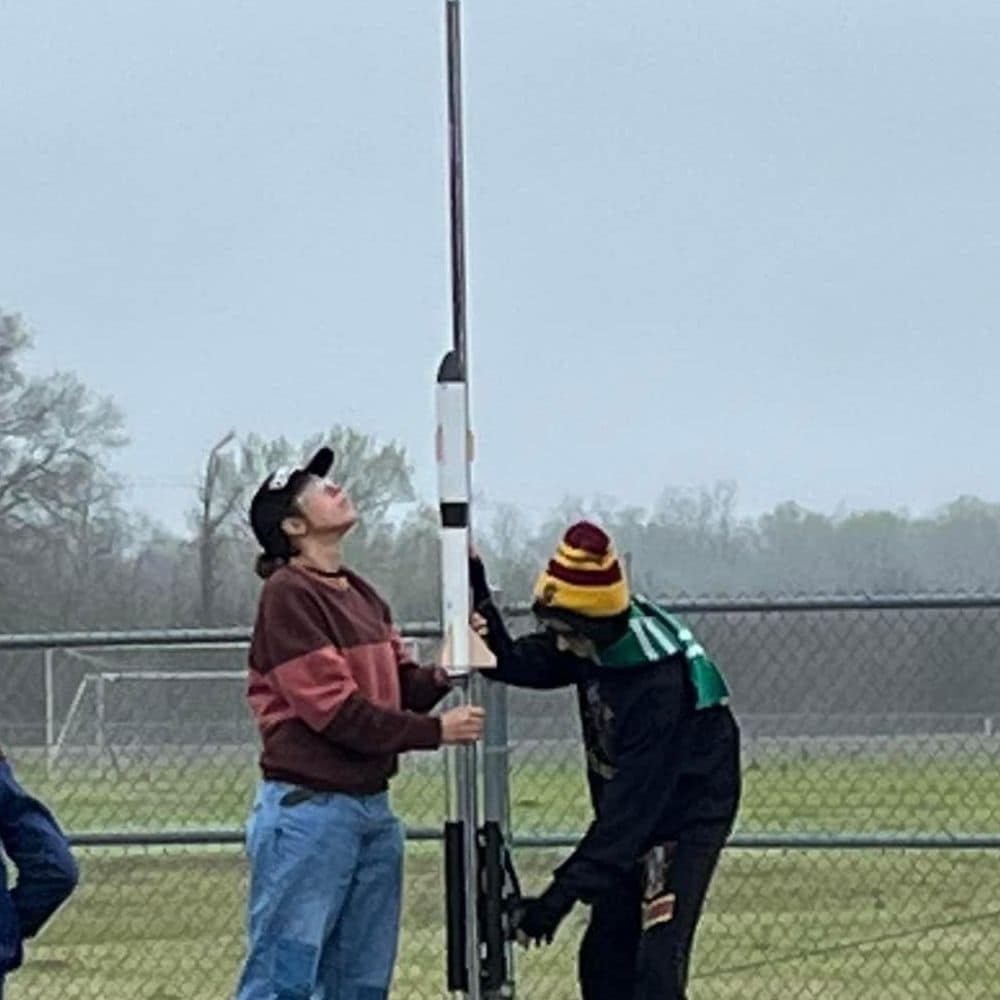 Aubrianne Dupre and her team from Parkway High are bundled against the cold as they position their rocket for launch. (Photo: Aubrianne Dupre)