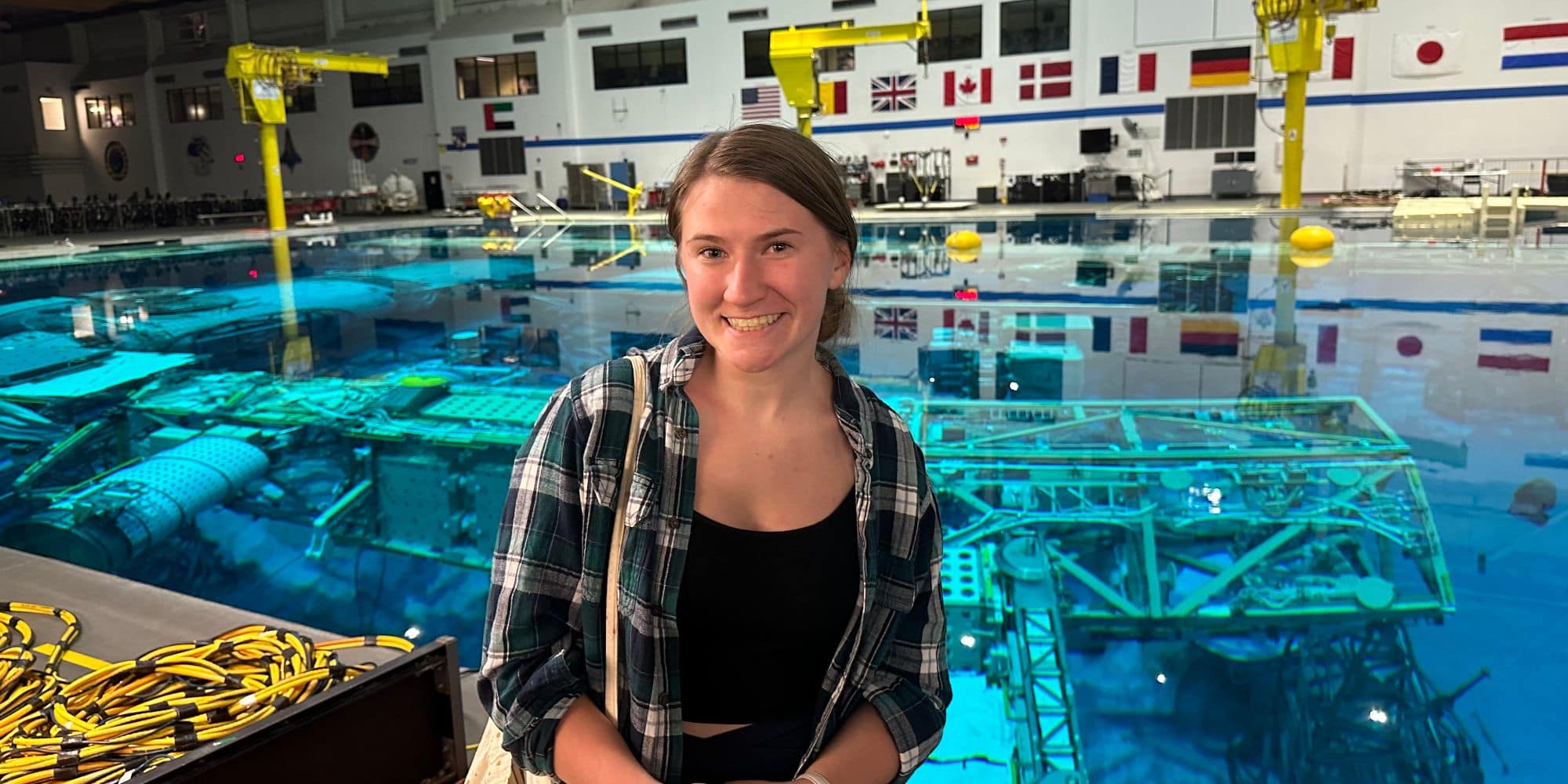 Engineering Physics student Kaley Eaton at NASA’s Neutral Buoyancy Lab, featuring a 1:1 scale model of the U.S. part of the International Space Station (ISS). (Photo: Kaley Eaton)