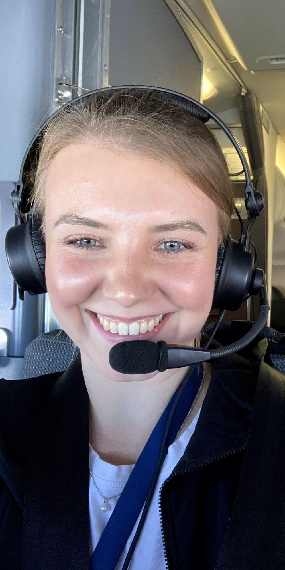 Megan Gill is all smiles as she gets ready for another leg of a trip on the flight deck of a Horizon Air ERJ-175. (Photo: Megan Gill)
