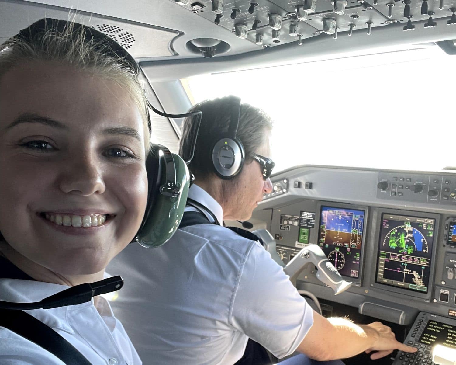Megan Gill enjoys her time with a Horizon Air crew on the flight deck of ERJ-175 en route to Santa Rosa, California.