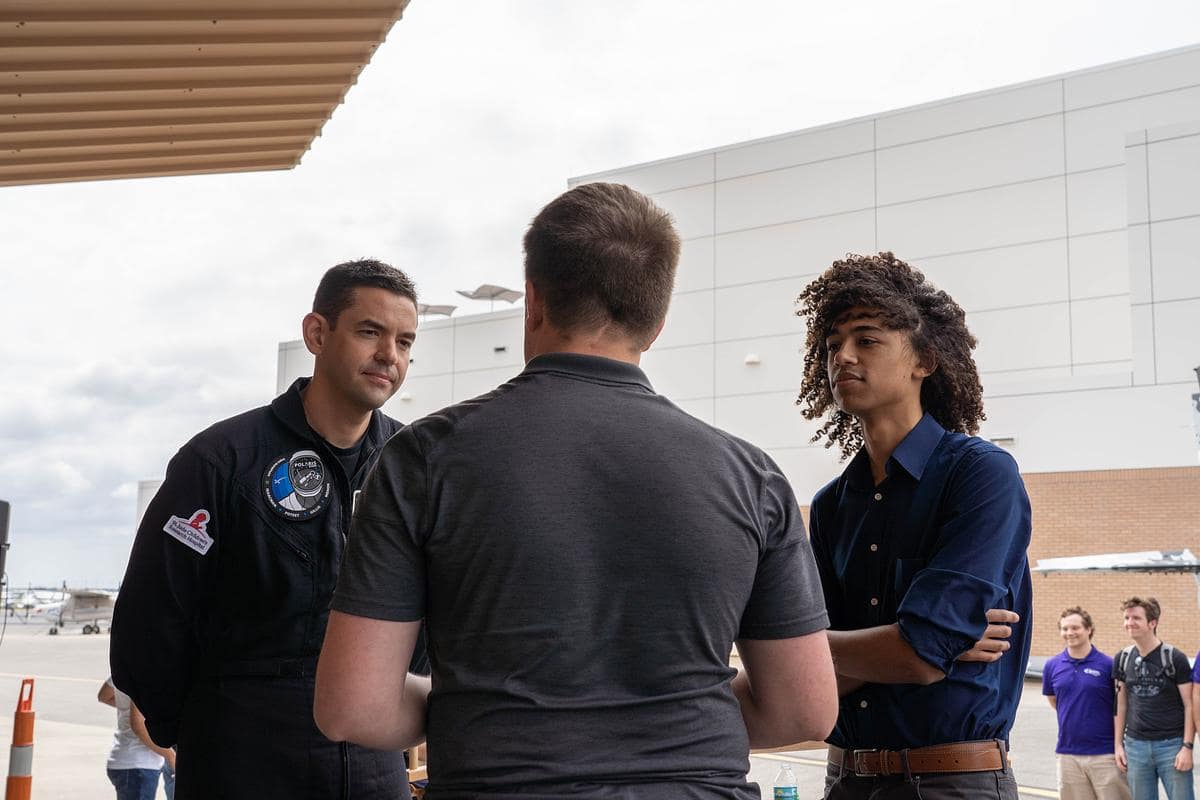 Students, Faculty and staff gather in the AMS Q Hangar for a presentation by astronaut and founder of Draken International, Commander Jared Isaacman. (Jack Wernet / Embry-Riddle)