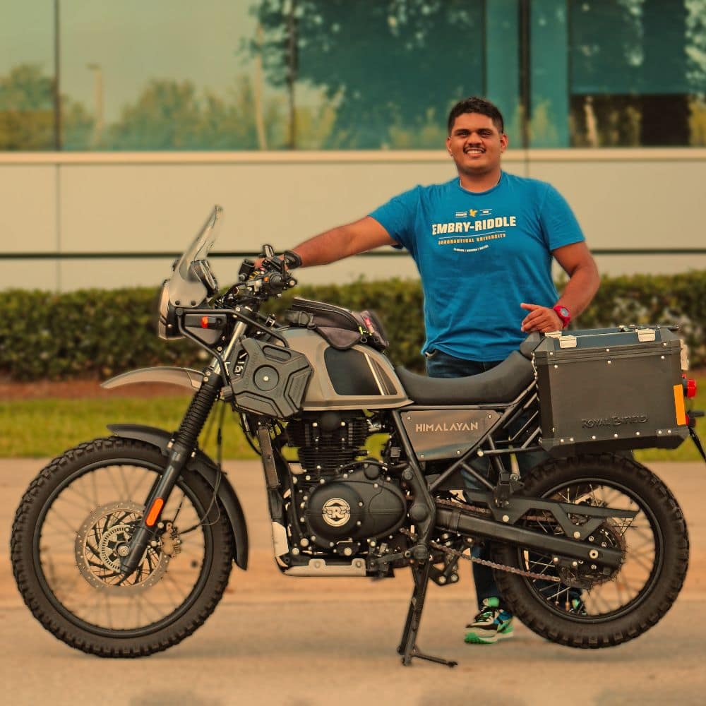 Mechanical Engineering student Arjun Menon with an adventure tourer motorcycle like those at the center of his traction control research. (Photo: Arjun Menon)