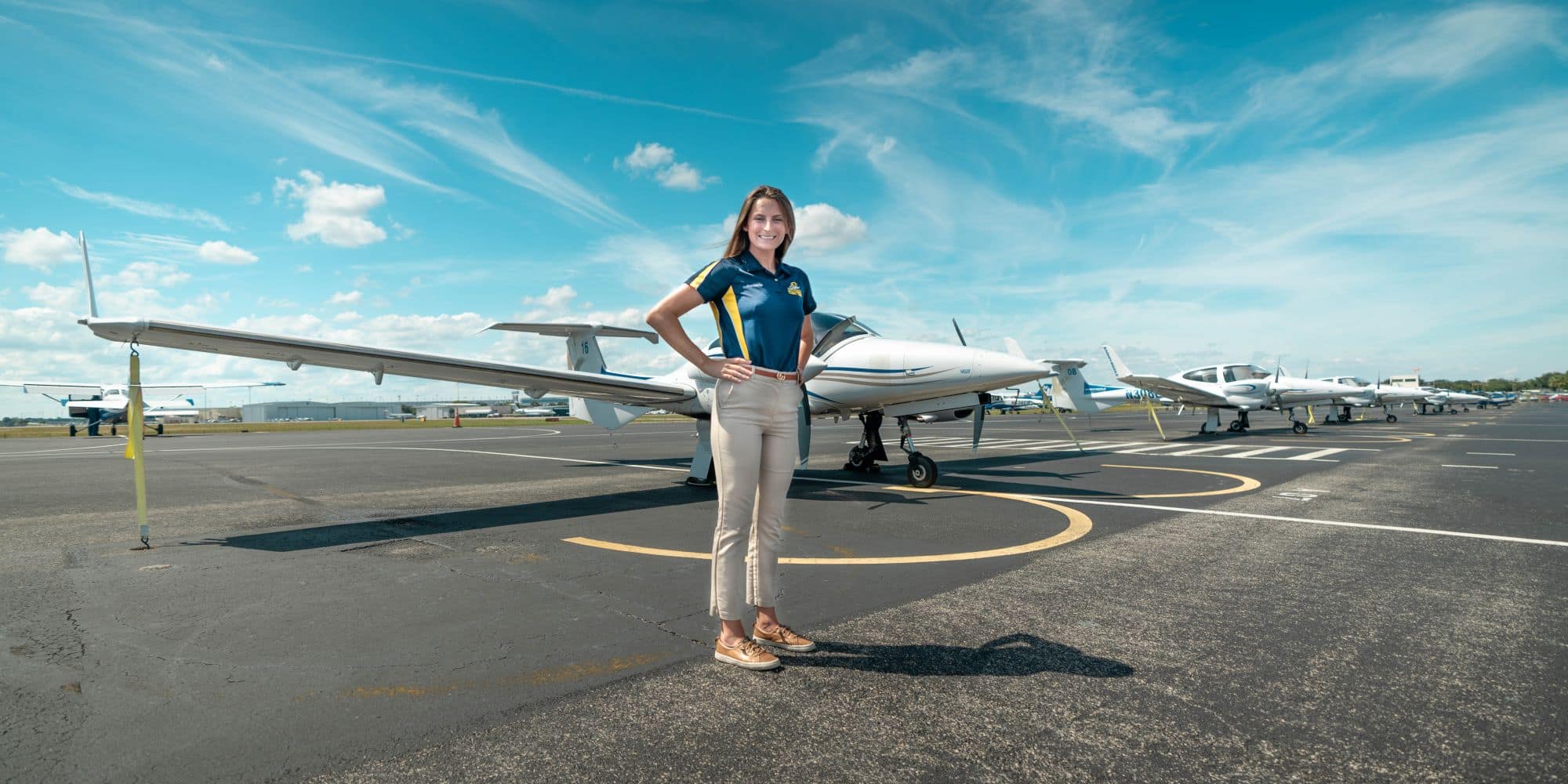 Aeronautical Science student Ann Marie Petrone stands in front of our Diamond DA-42 Twin Star multi-engine aircraft. 