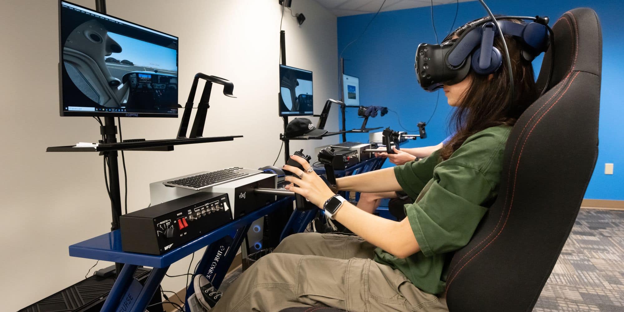 Embry-Riddle student Laurayna Pick, a freshman Aeronautical Science major, conducts virtual-reality flight training maneuvers at the Advanced Flight Simulation Center. (Photo: Embry-Riddle / Bernard Wilchusky)
