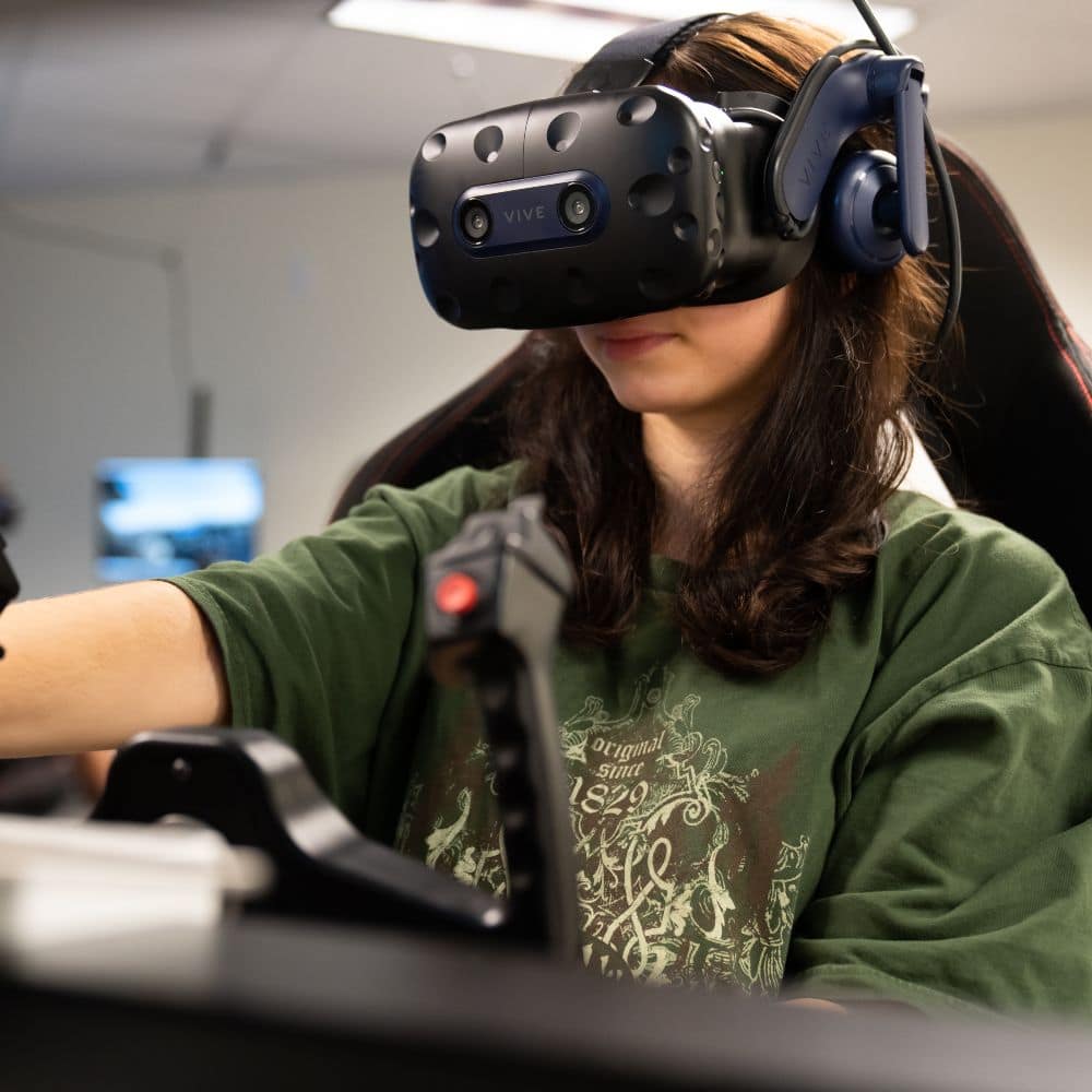 Embry-Riddle student Laurayna Pick, a freshman Aeronautical Science major, conducts virtual-reality flight training maneuvers at the Advanced Flight Simulation Center. (Photo: Embry-Riddle / Bernard Wilchusky)