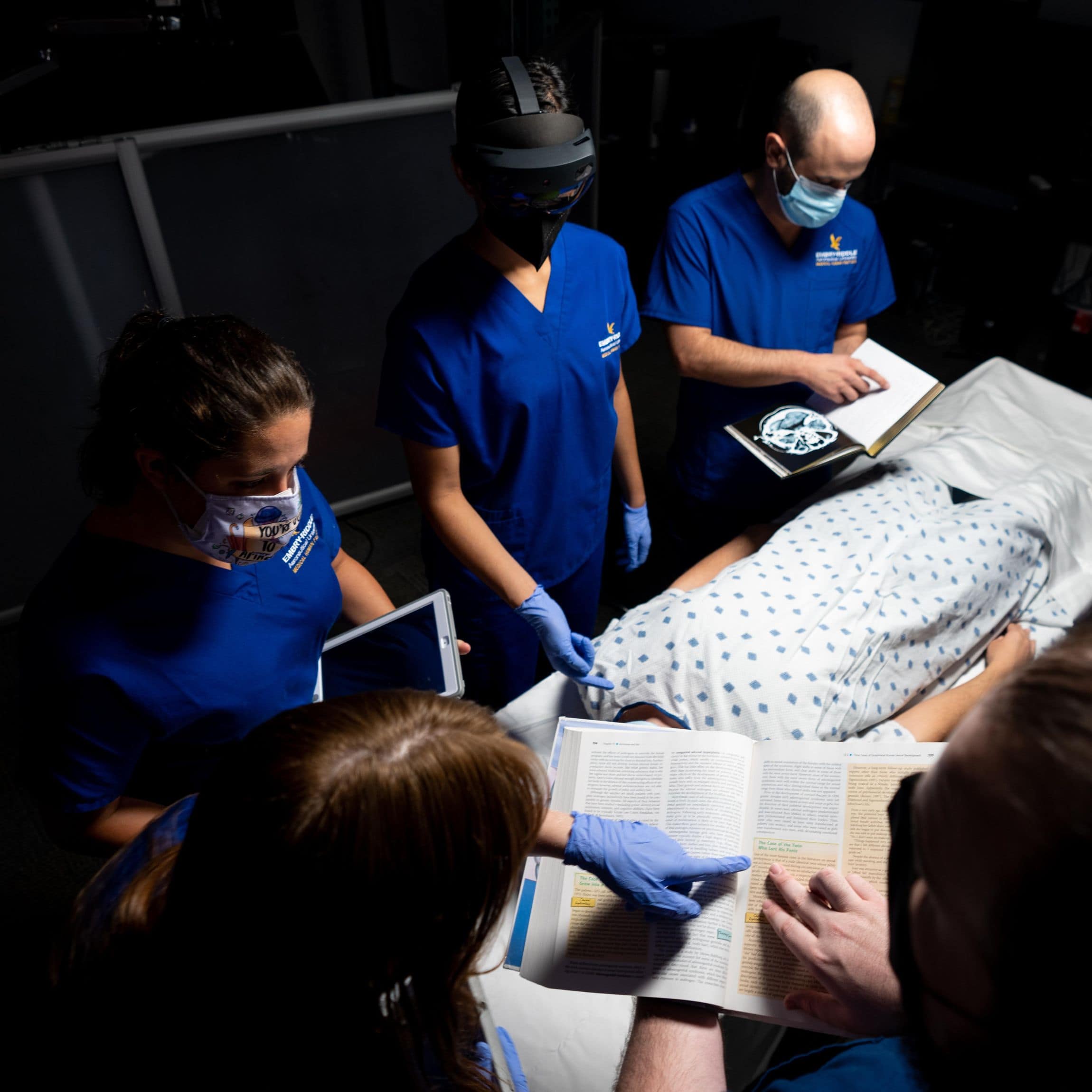 Using a mock hospital scenario, Aerospace Physiology students from the STAR Lab research the logistics and teamwork involved in how healthcare workers “hand off” patients from one team to another. (Embry-Riddle/David Massey)