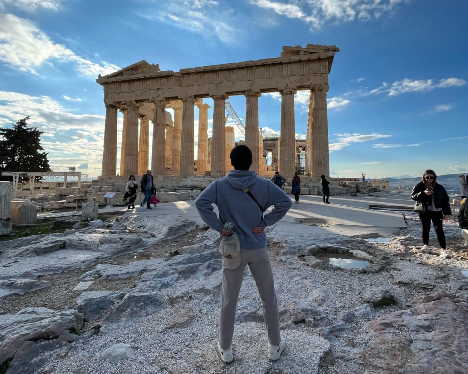 A student stands in front of ancient ruins while pursuing his degree studying abroad. (Photo: Brandon Leong)