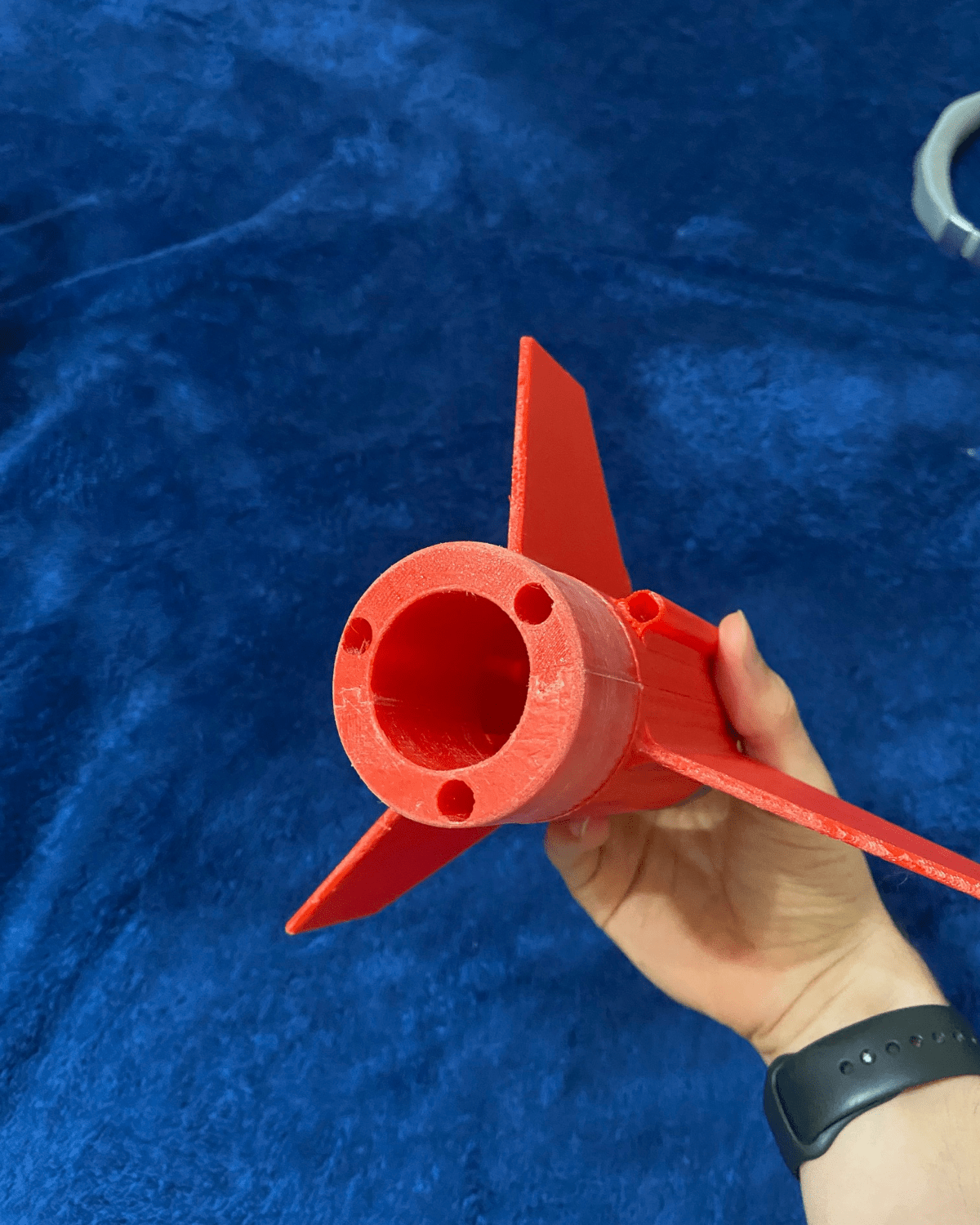 Jacob Zahabi shows one of the rocket fin caps he created with a 3D printer. (Photo: Jacob Zahabi)