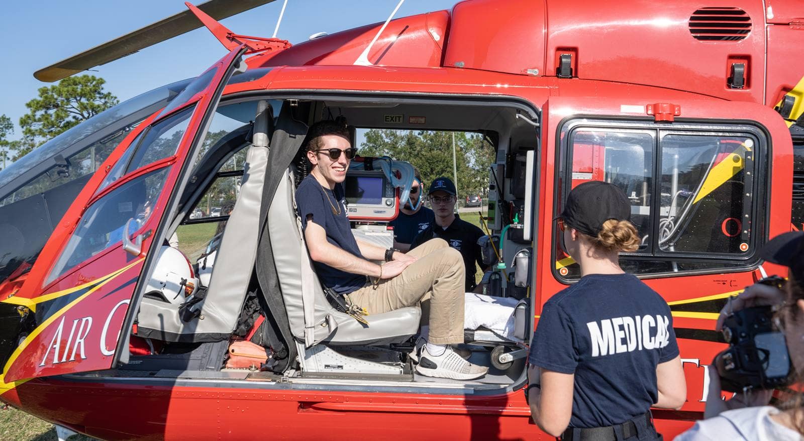 Man sits on a rescue helicopter.