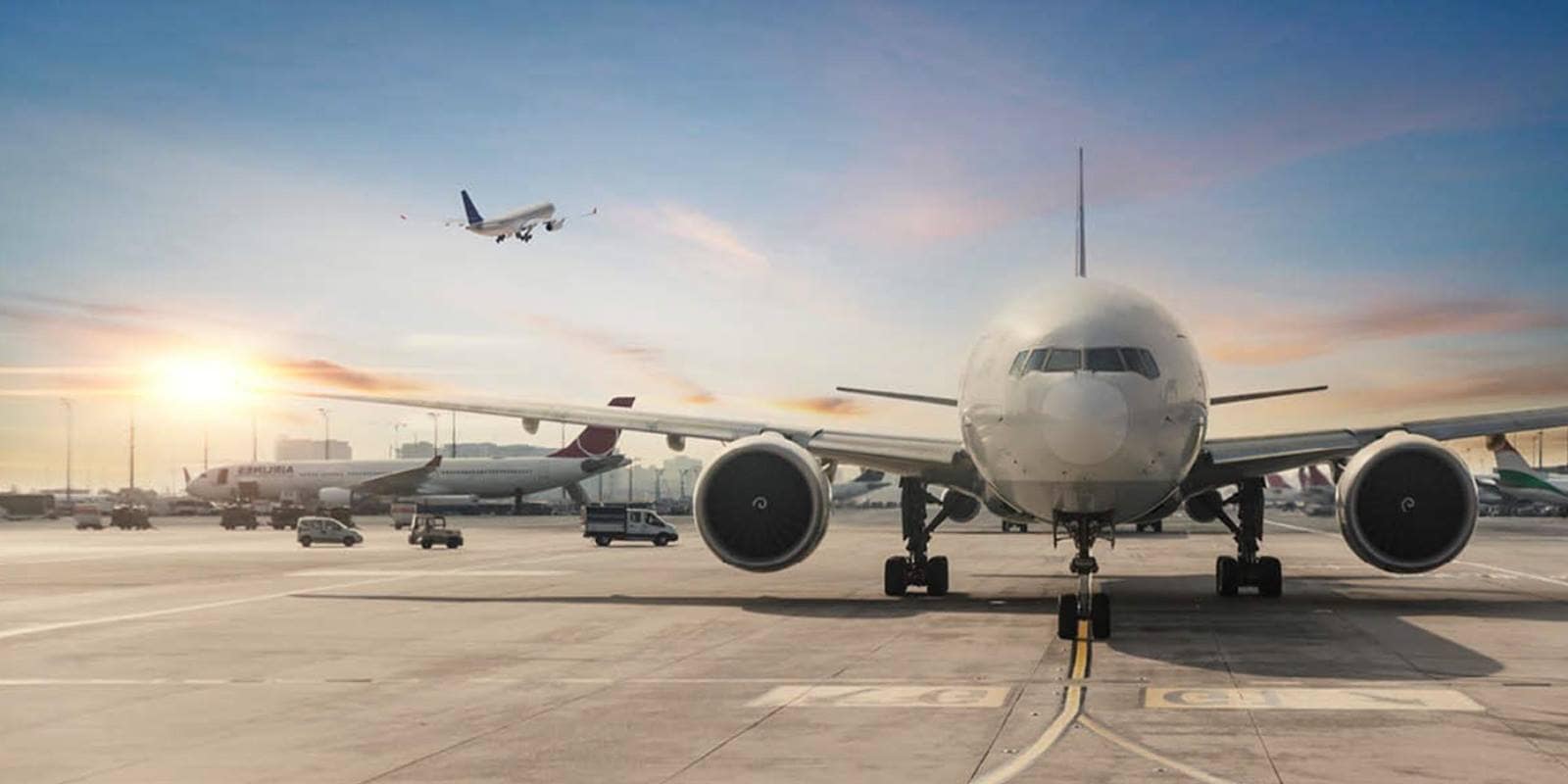 The front of an airplane in an airport.