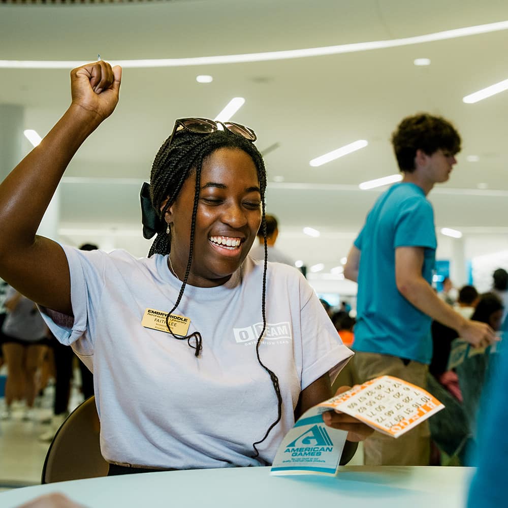 A female student wears a hijab and Mental Health Matters shirt at a suicide prevention event.