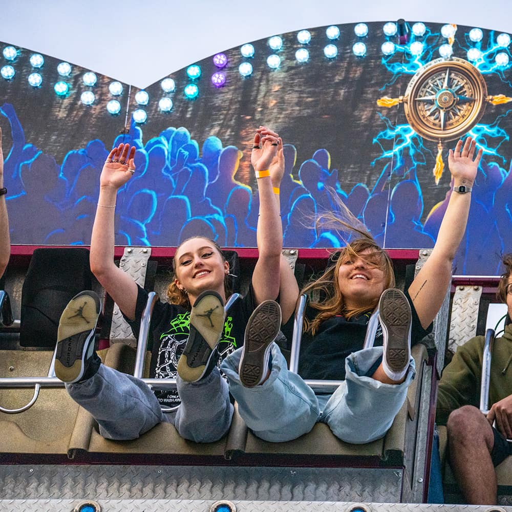 Female soccer players high-five after practice.