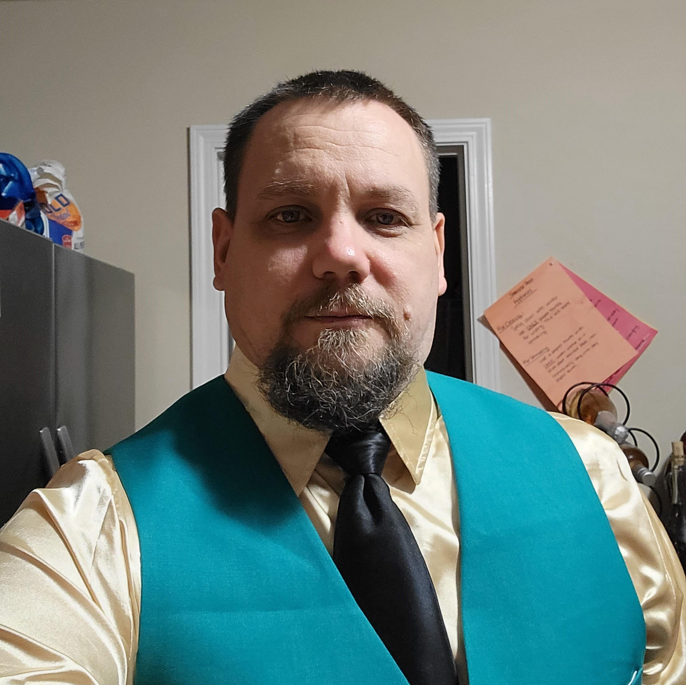 Andrew Appleby, dressed professionally.