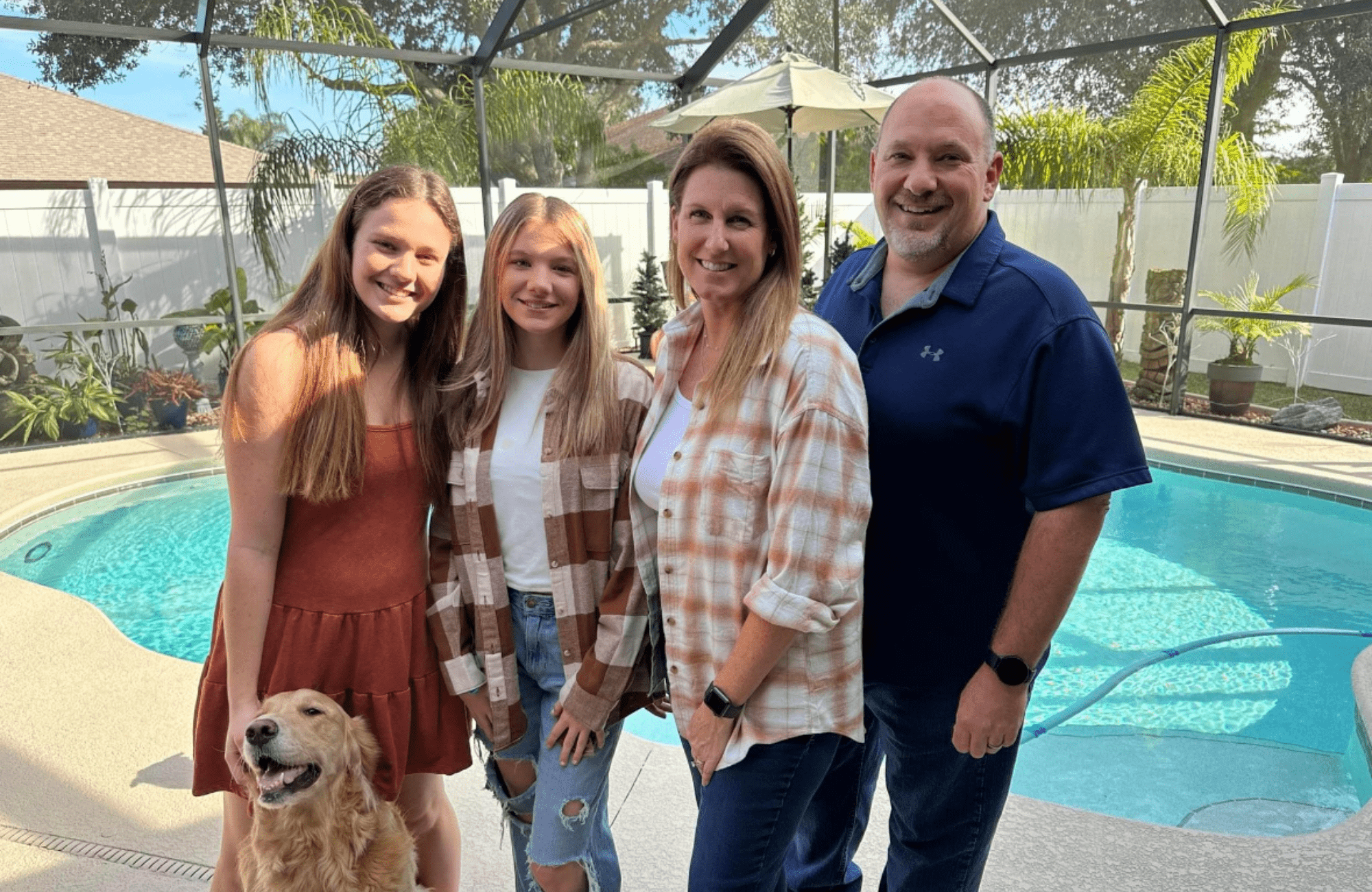 Ashley Cathon (left), with her sister Brooke, mom, dad and dog, Lulu, in a recent family portrait. (Photo: Ashley Cathon)