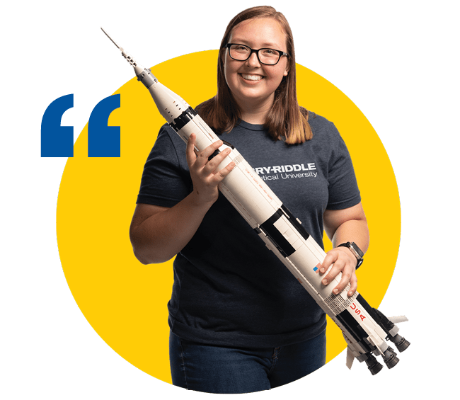 Kayla Davis with a model rocket.