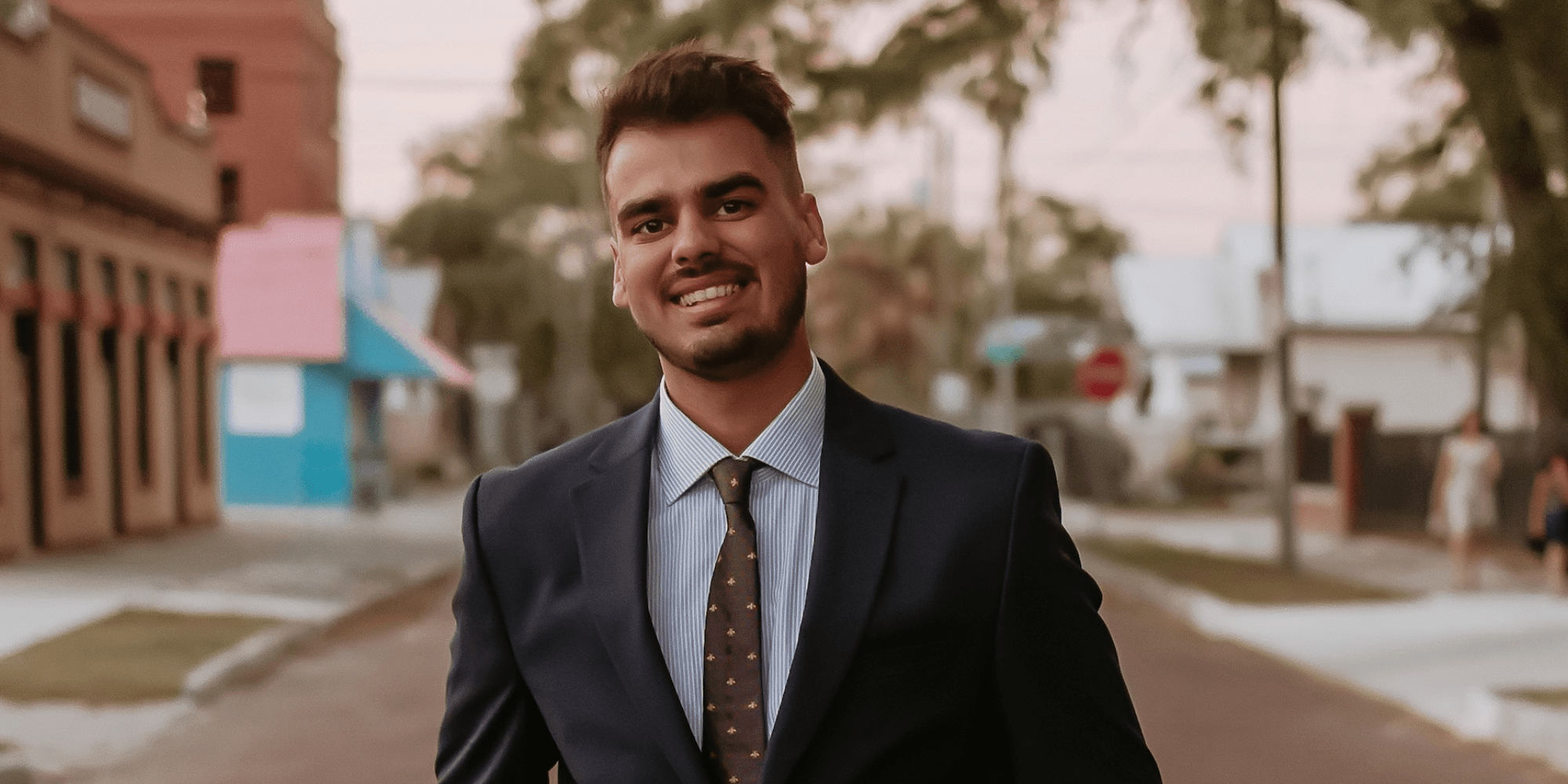 Justin Nunamaker in a suit, headshot.