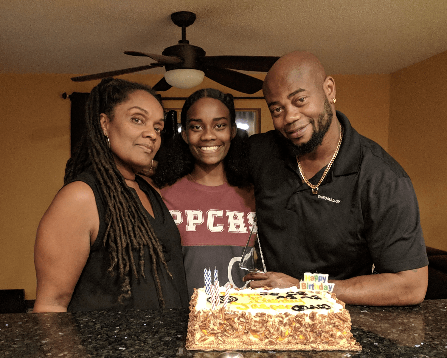 In this photo from December 2017, Coral Scotland and her mom, Dr. Dion Phillips-Scotland, celebrate the birthday of Coral’s dad, Robert Scotland. (Photo: Coral Scotland)