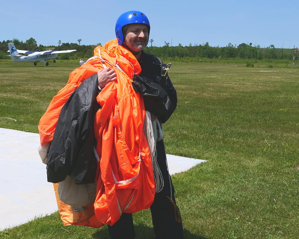 Eugene Pik after completing a jump at the Parachute School of Toronto. (Photo: Eugene Pik)