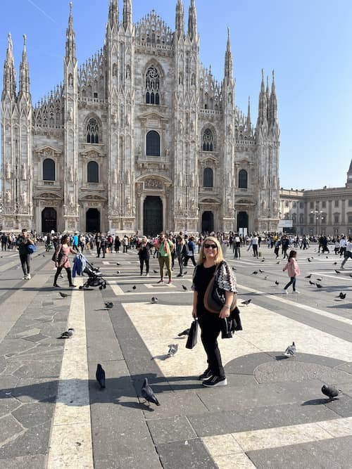 woman standing in front of cathedral in Milan, Italy