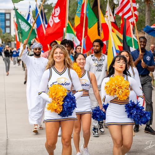 ERAU cheerleaders leading the International Flag Parade