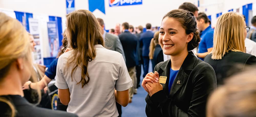 woman smiling at an Embry-Riddle career fair