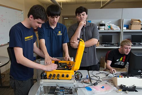 students work on a robotic sub
