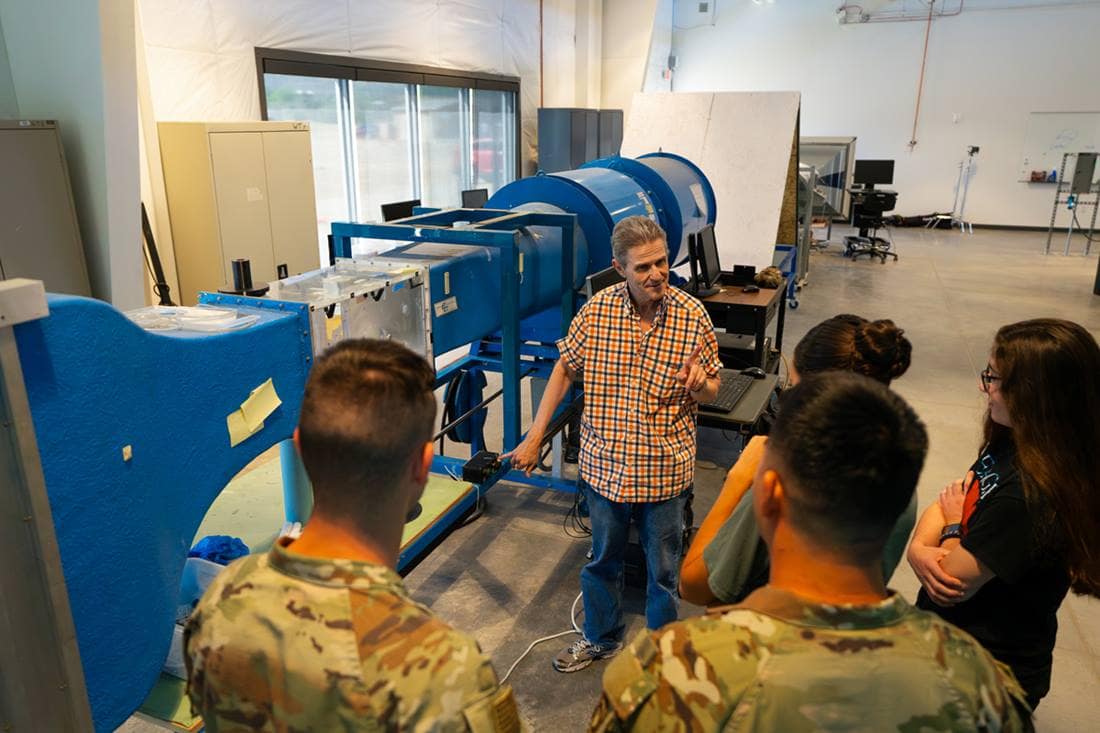 Students with a wind tunnel experiment