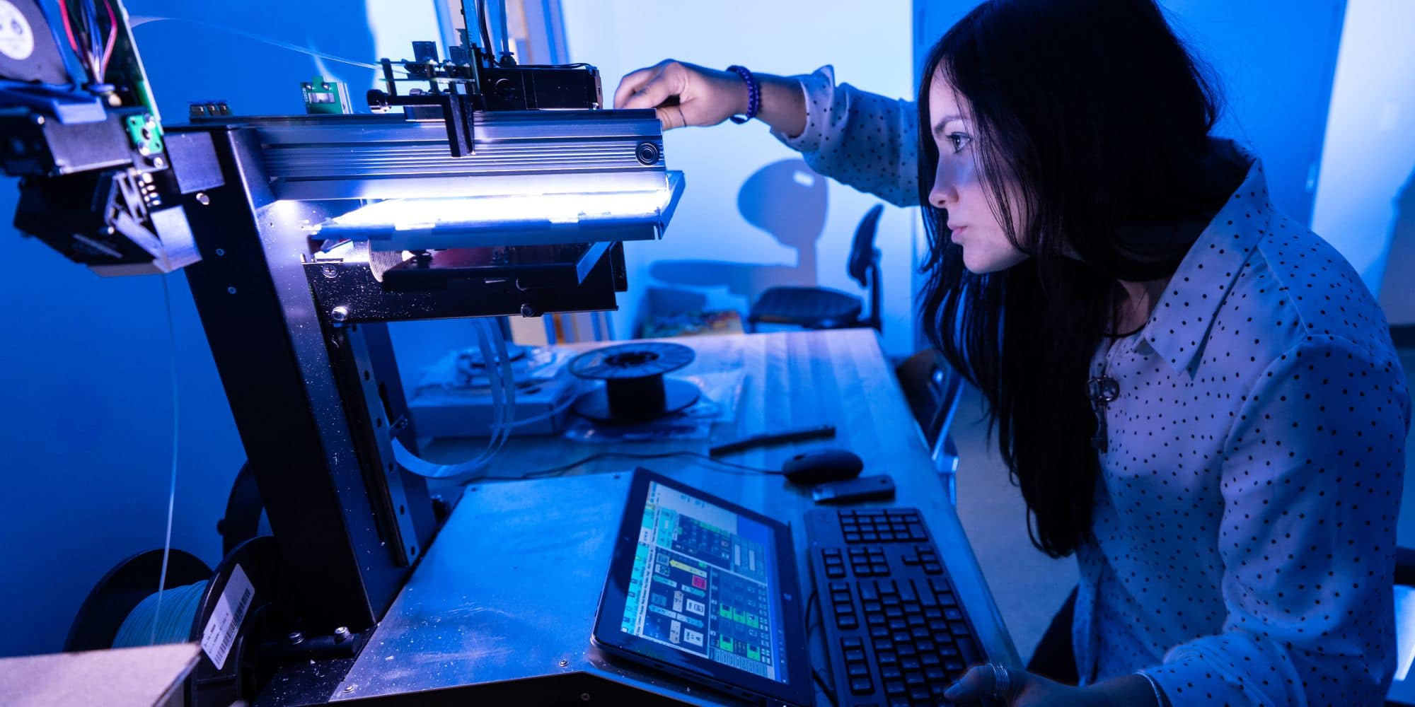 Embry-Riddle Graduate Student Noemi Miguelez works in the parts manufacturing section of the WiDE lab at the MicaPlex