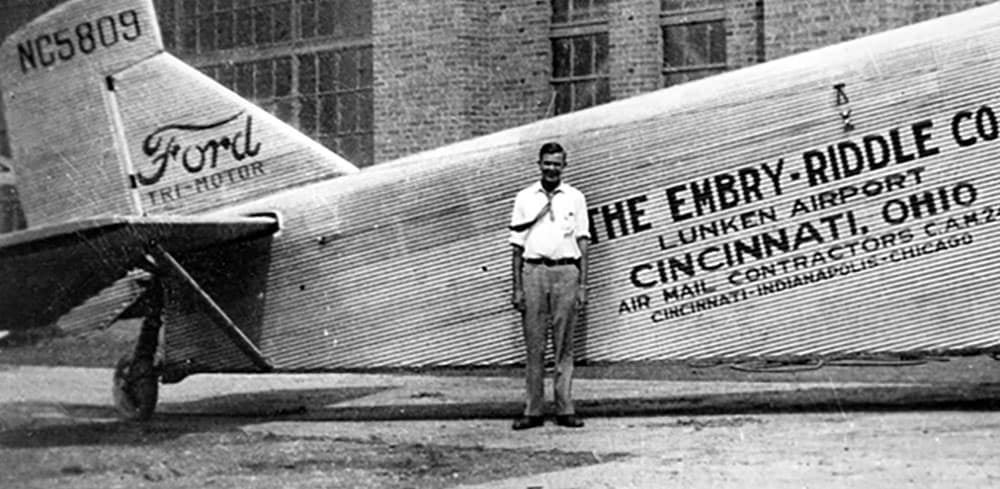 Man standing in front of a plane
